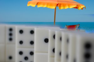 Playing dominoes in Barbados Dominoes