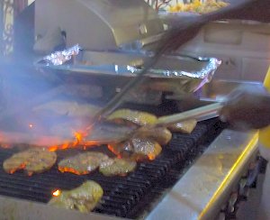 Grilling fish at Oistins Fish Fry Grilling fish