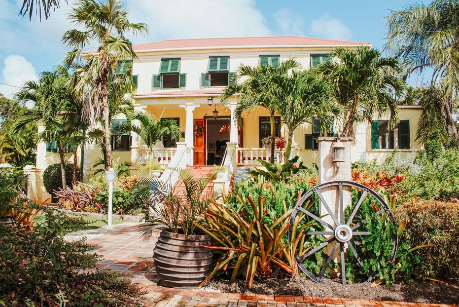 Tropical gardens and steps leading up to Sunbury Plantation Great House